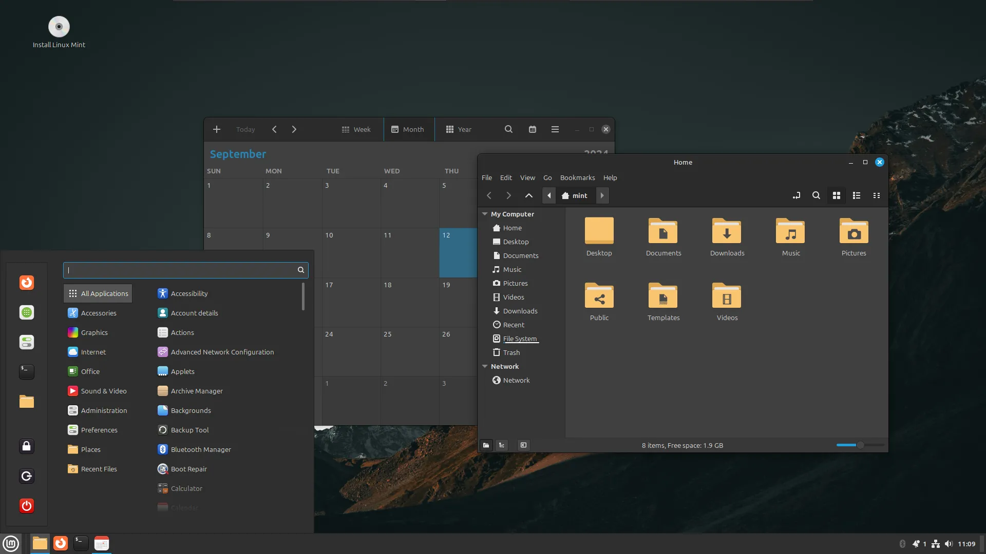 Giao diện desktop của Linux Mint với ứng dụng lịch và trình quản lý tệp đang mở, minh họa một hệ điều hành Linux di động.