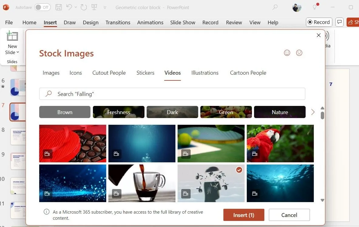 Hộp thoại Stock Videos trong PowerPoint hiển thị thư viện video có sẵn từ Microsoft 365 với nút Insert để chèn video đã chọn.