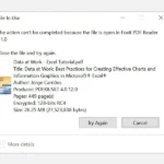 Thông báo lỗi "File đang được sử dụng" trên Windows 10 khi người dùng cố gắng xóa tệp PDF đang mở.